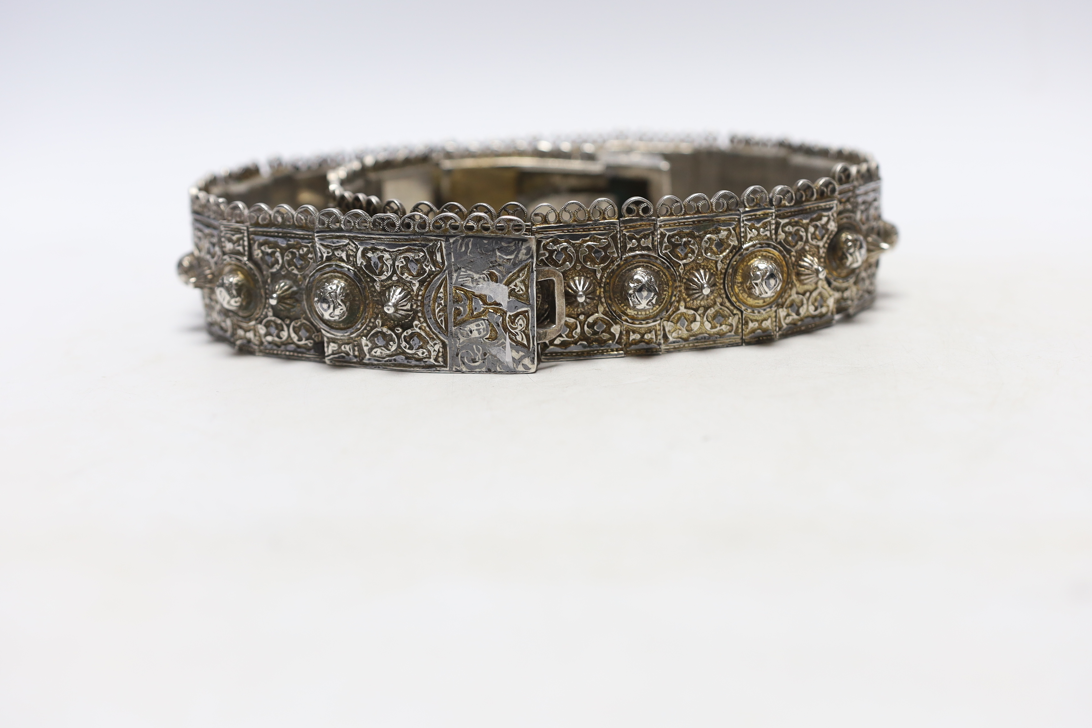 An early 20th century Russian 84 zolotnik belt, with raised conical and domed stud decoration, 79.5cm